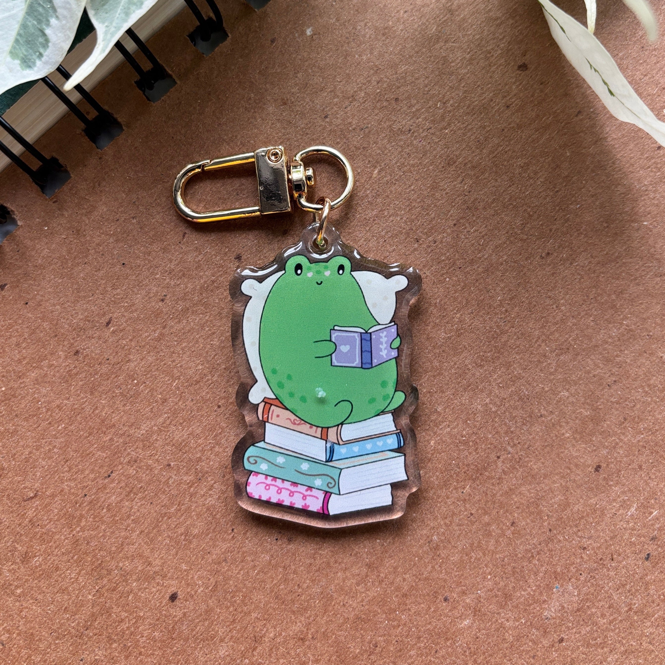 Cozy Frog Reading Acrylic Keychain