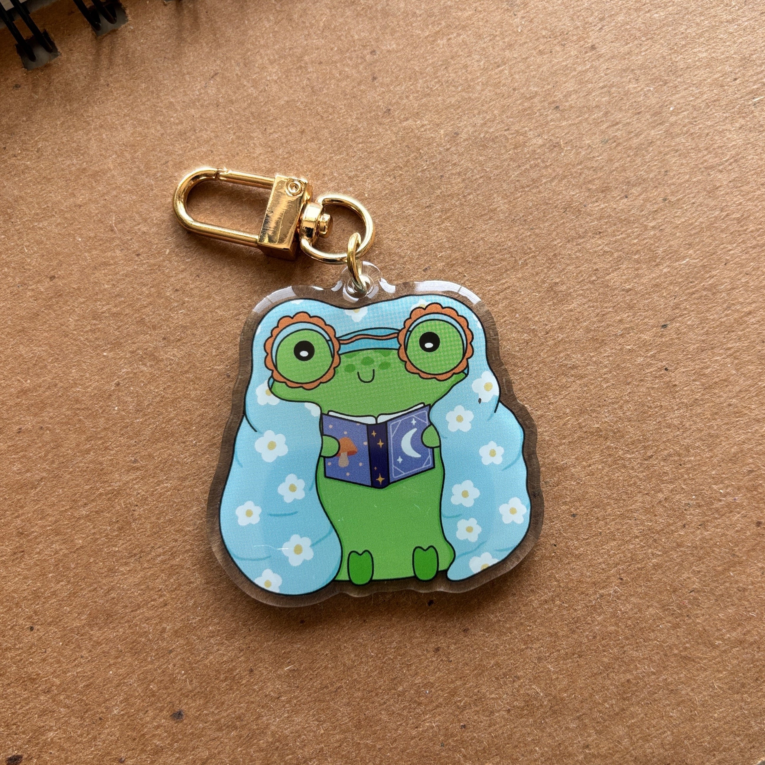 Cozy Froggy Reading Acrylic Keychain